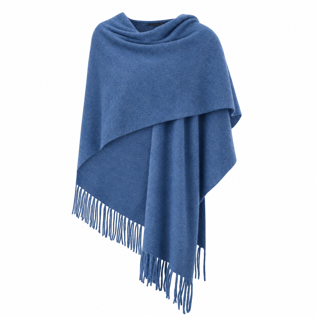 A denim blue fringed cashmere wrap draped over a mannequin torso, shown against a plain white background.