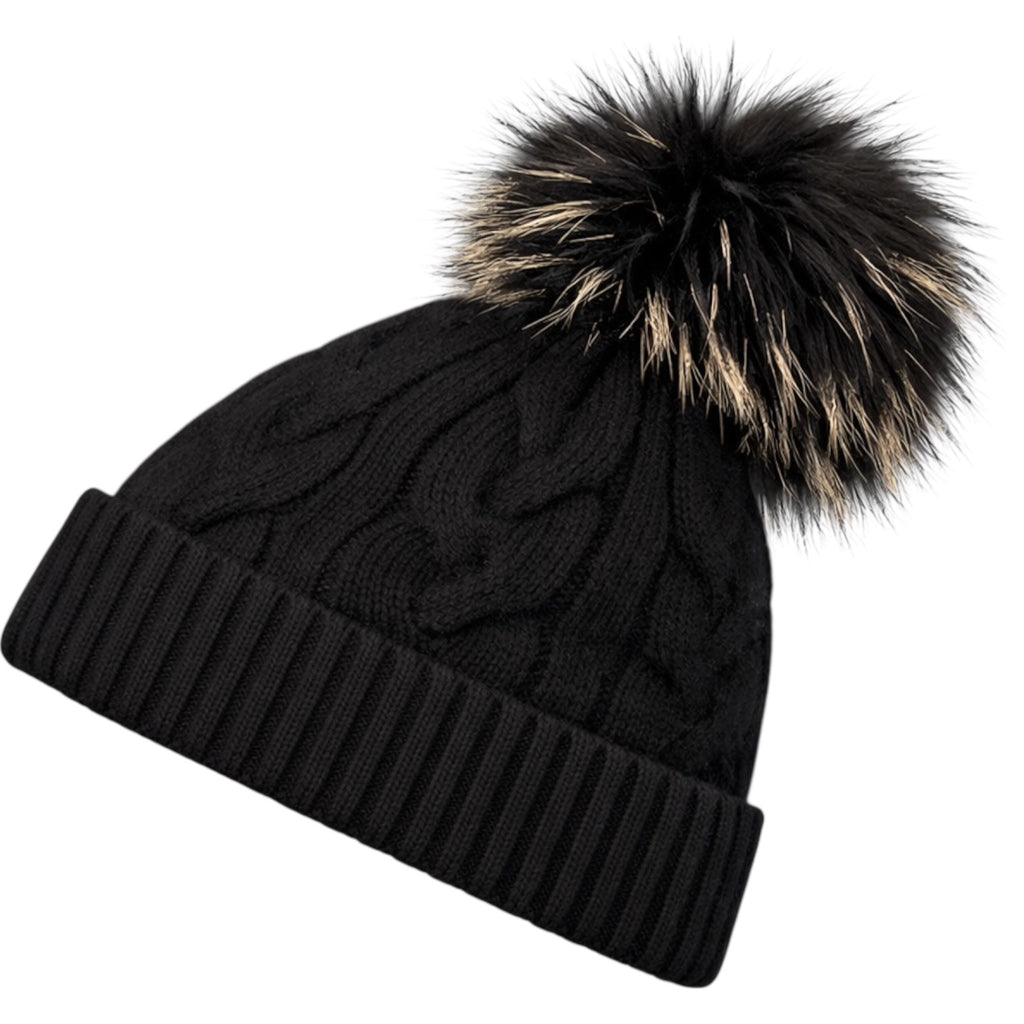 Side view of black cable knit cashmere beanie with detachable raccoon fur pom pom
