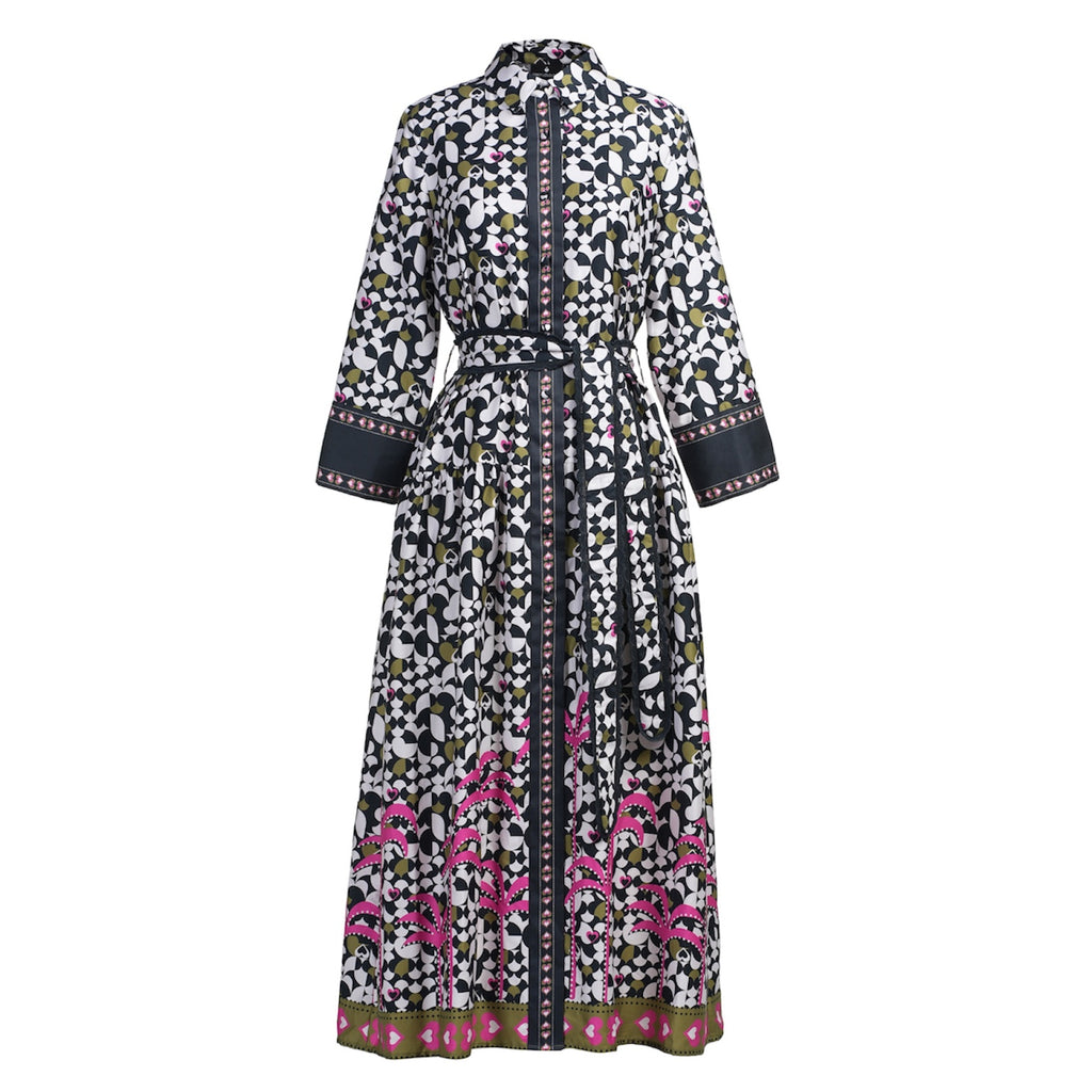 Long floral dress with a patterned belt by Emily Lovelock