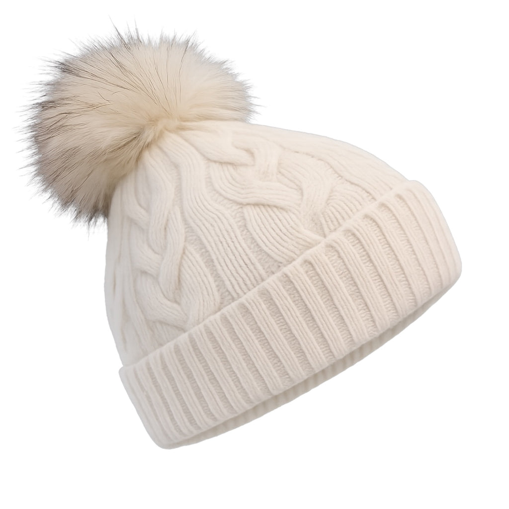 Side view of white cable knit cashmere beanie with detachable raccoon fur pom pom